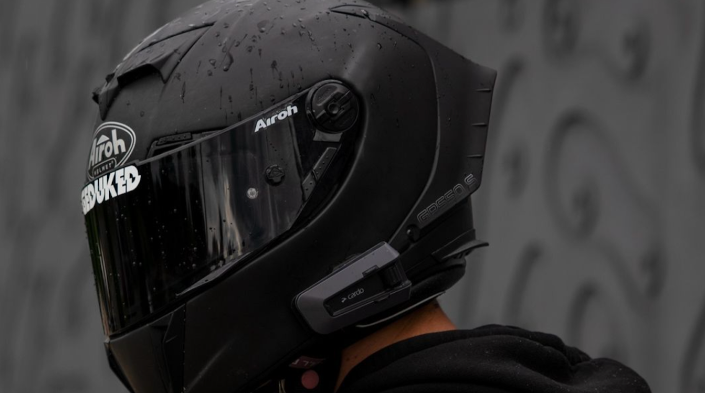 close up shot of motorcycle helmet communicator on helmet