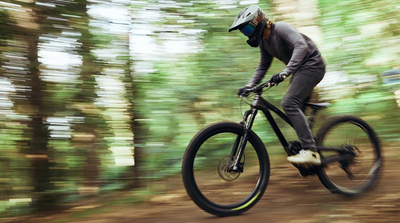 blurred bike workout on woods path