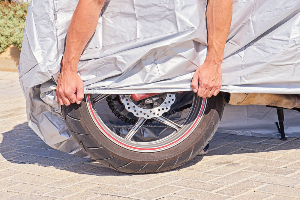 covering motorcycle with protective tarp