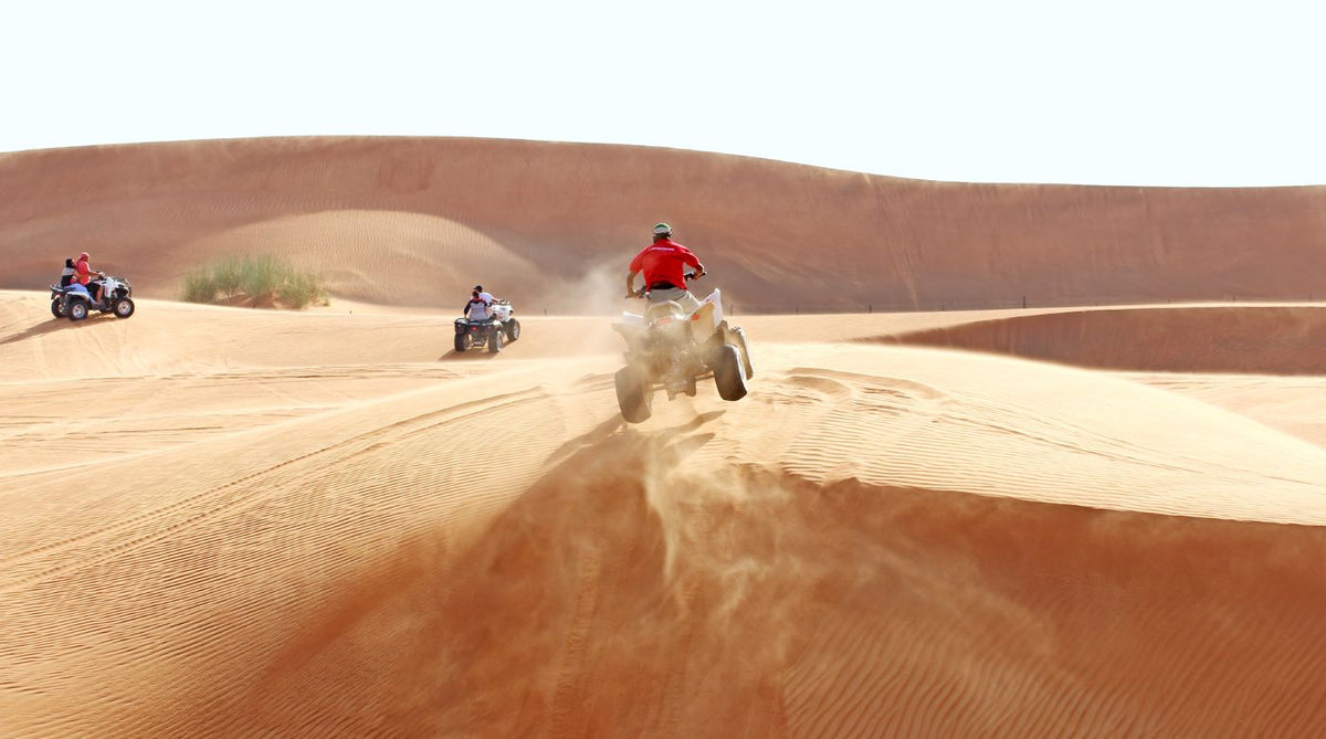 atv jumping on sand dune