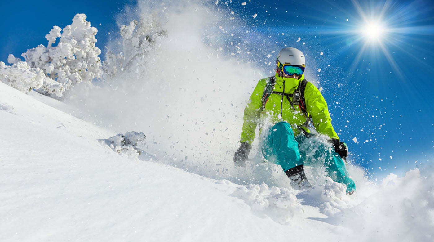 fresh powder snow skiing down hill