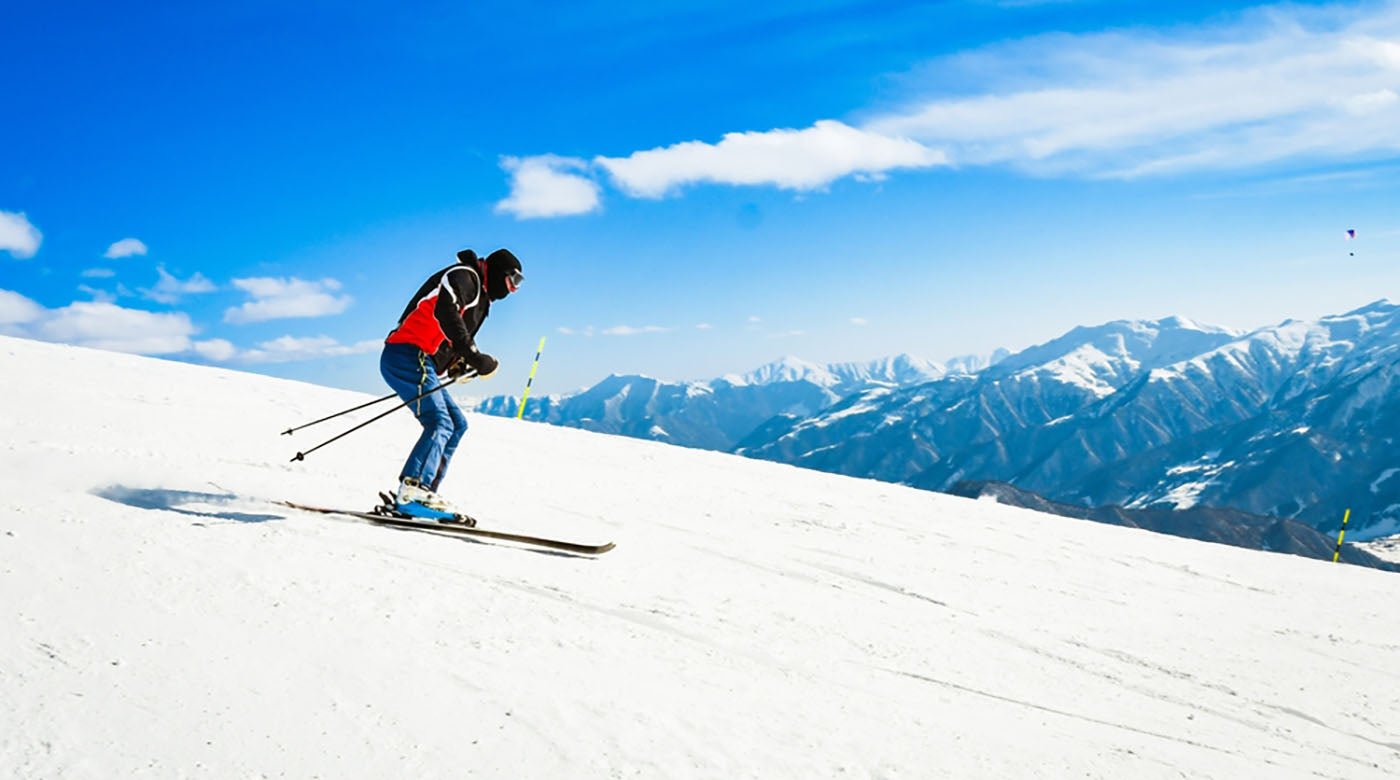 side view skier wearing black